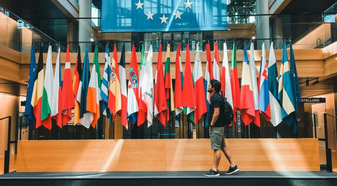 Decorative Photo by Ali Levlog: https://www.pexels.com/photo/flags-in-european-parliament-building-in-strasbourg-france-14232002/